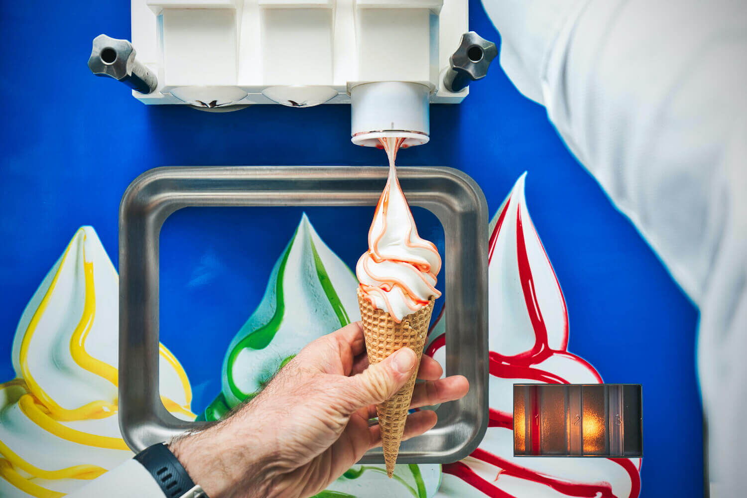 Soft ice cream comes out of the machine