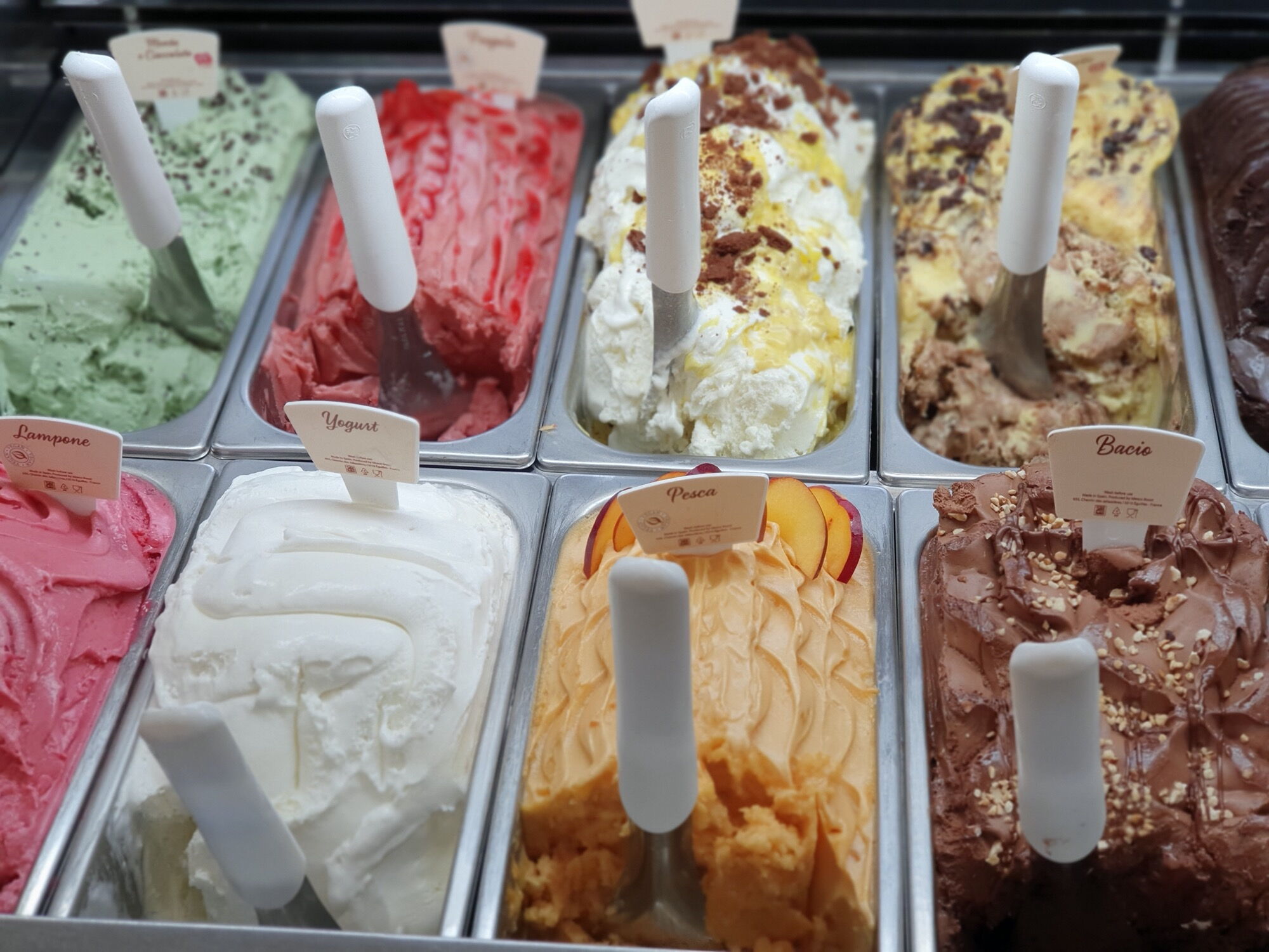 A poor ice cream presentation in a display case in an ice cream café